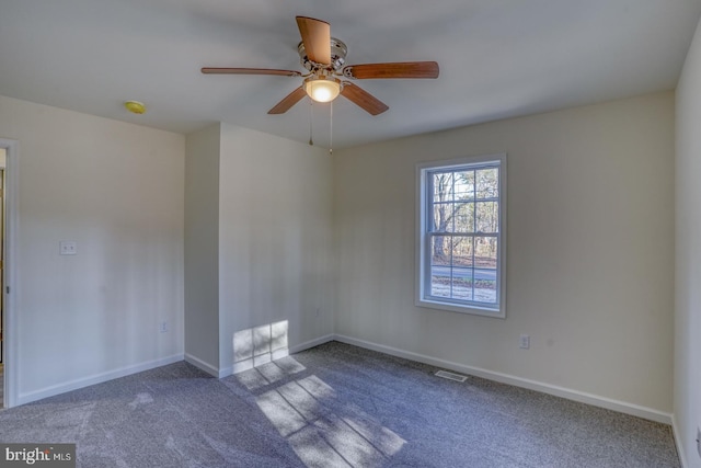 empty room with carpet floors and ceiling fan