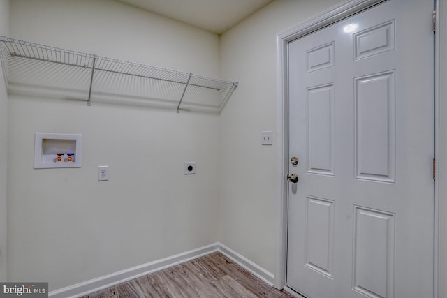 clothes washing area featuring hookup for a washing machine, electric dryer hookup, and wood-type flooring