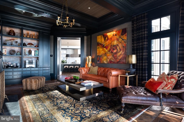 interior space featuring beamed ceiling, an inviting chandelier, a wealth of natural light, and ornamental molding