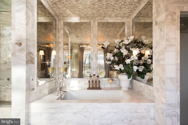 bathroom with tiled bath