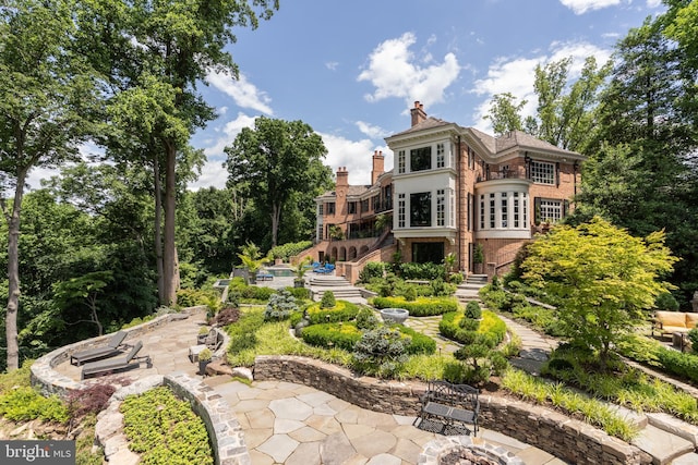 back of house featuring a patio area