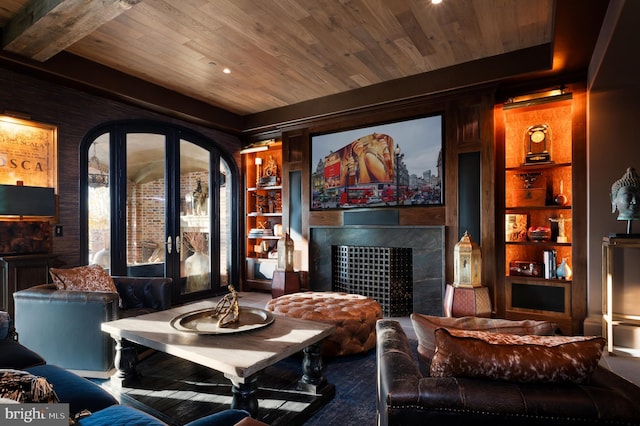 home theater room featuring built in features, wooden ceiling, and french doors