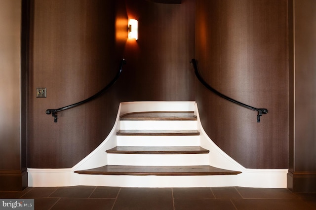 stairs featuring tile patterned flooring