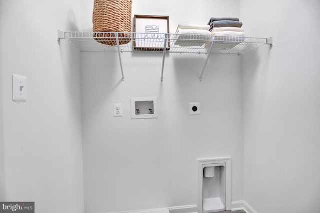 laundry room featuring laundry area, washer hookup, electric dryer hookup, and baseboards