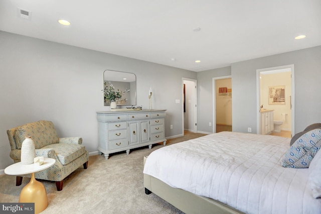 bedroom featuring recessed lighting, light carpet, a spacious closet, and baseboards