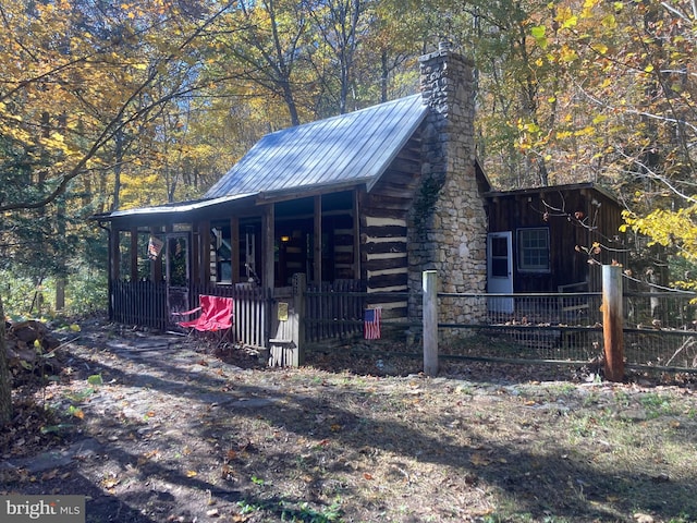 view of outbuilding featuring covered porch