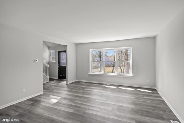 empty room featuring dark hardwood / wood-style flooring