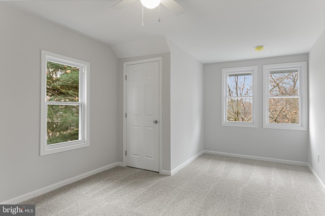 spare room featuring carpet flooring and ceiling fan