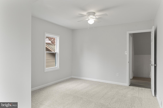 spare room with carpet flooring and ceiling fan