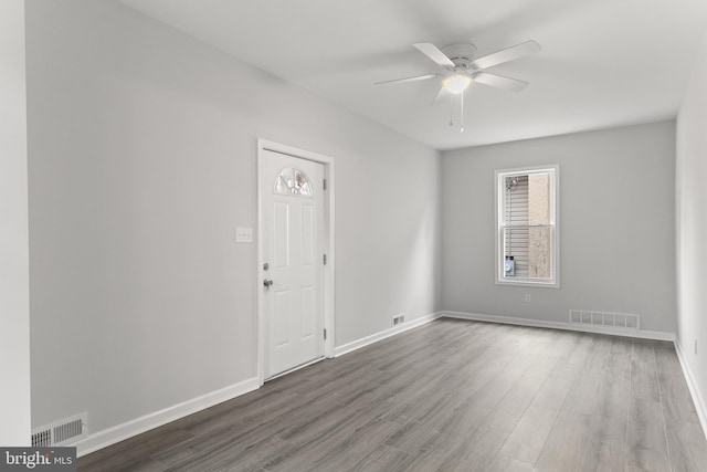 spare room featuring ceiling fan and hardwood / wood-style floors