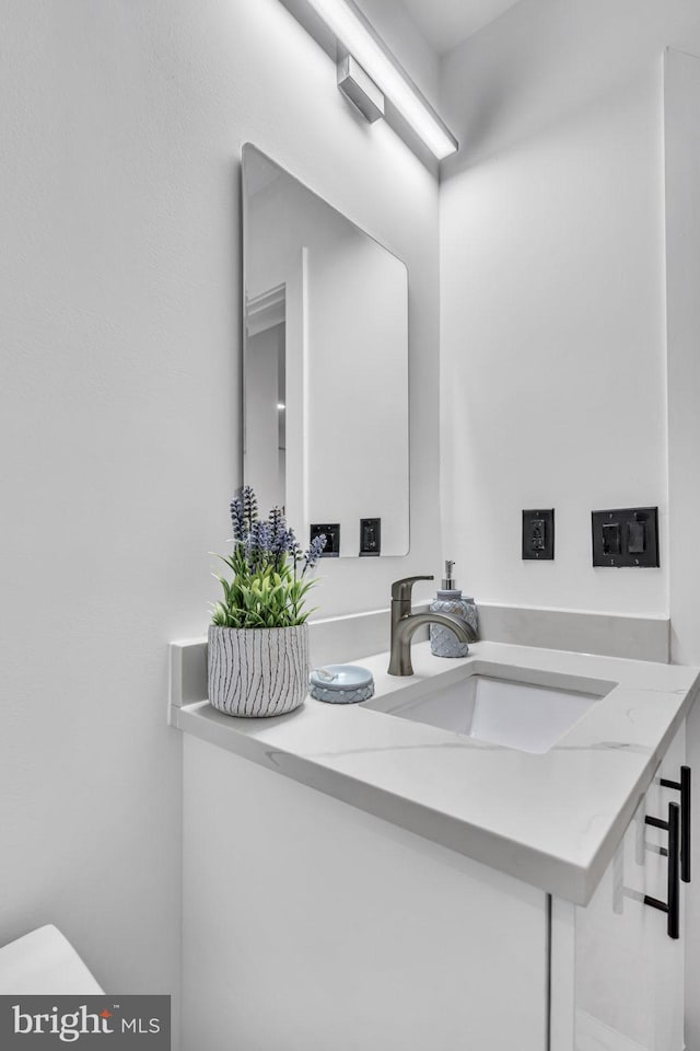 bathroom featuring toilet and sink