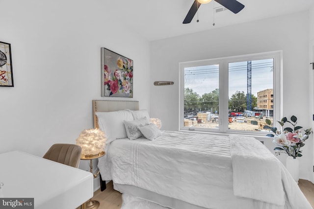 bedroom featuring hardwood / wood-style flooring and ceiling fan