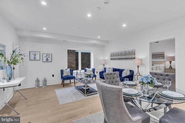 dining area with light hardwood / wood-style floors