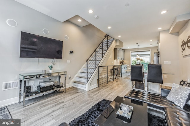 living room with light hardwood / wood-style floors