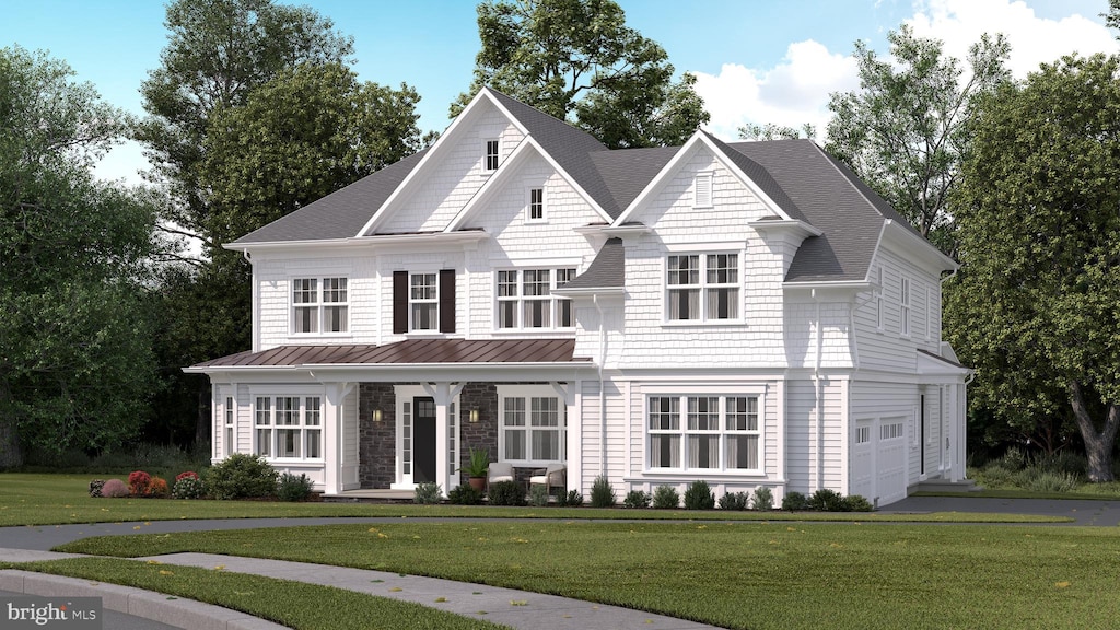 view of front facade with a garage and a front yard