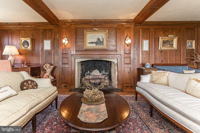 living room featuring beam ceiling, wooden walls, and hardwood / wood-style floors