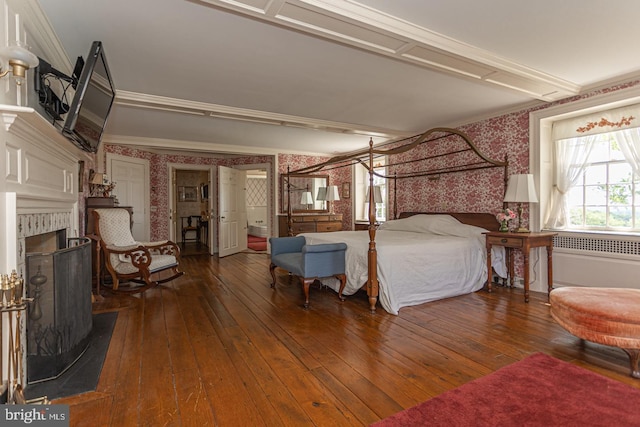 bedroom featuring crown molding and hardwood / wood-style floors