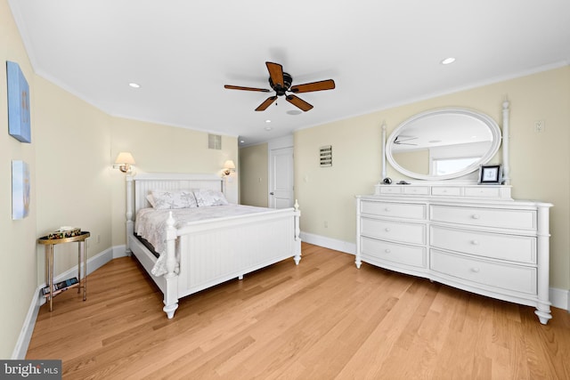 bedroom featuring ceiling fan, ornamental molding, and light hardwood / wood-style flooring