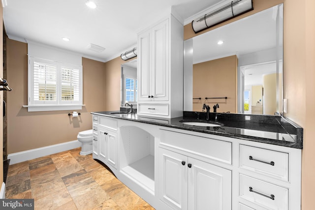 bathroom featuring tile flooring, dual vanity, and toilet