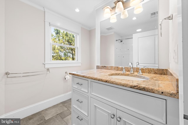 bathroom with tile flooring, ornamental molding, and oversized vanity