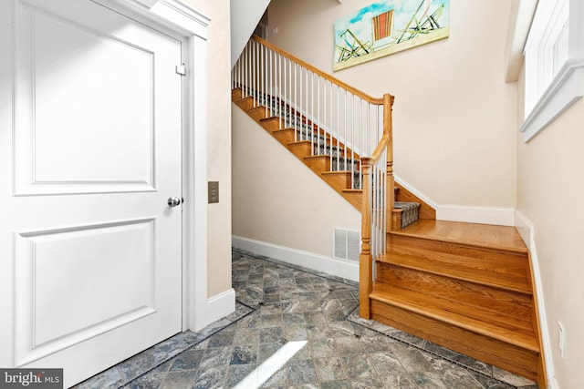 stairs with tile flooring