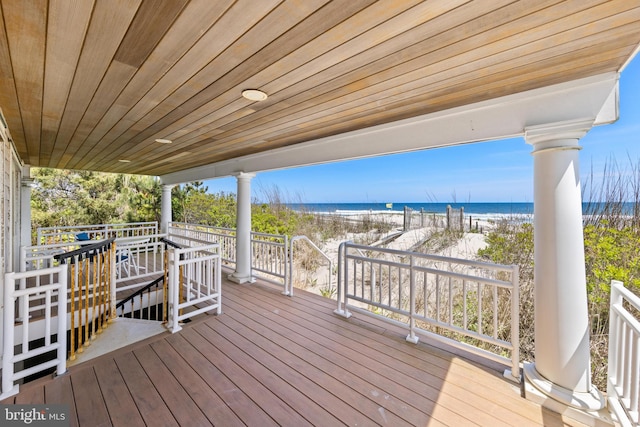 wooden terrace with a water view