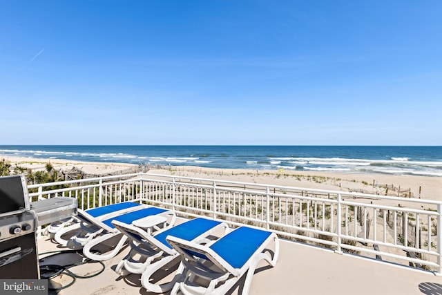 exterior space with a beach view and a water view