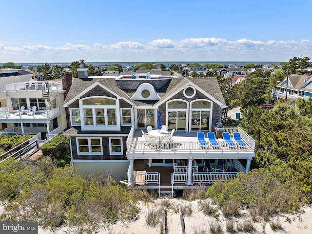 rear view of house with a balcony