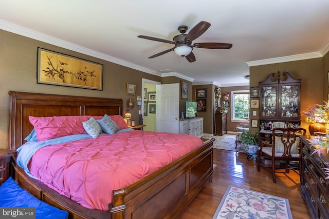 bedroom with ceiling fan, crown molding, and dark wood-type flooring