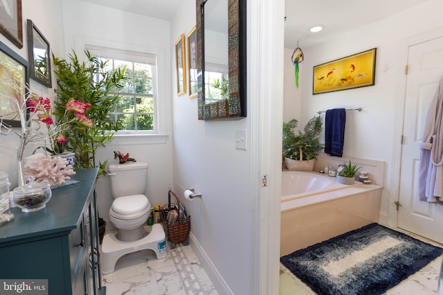 bathroom with a bath and toilet