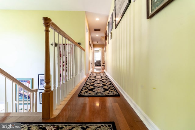 hallway with wood-type flooring