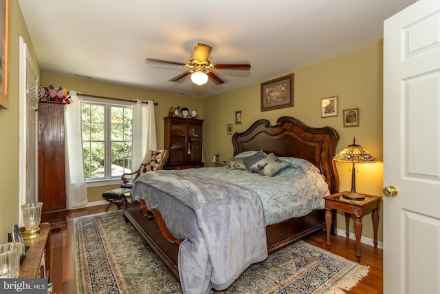 bedroom featuring hardwood / wood-style flooring and ceiling fan