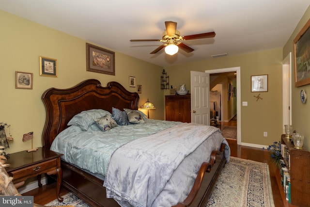 bedroom featuring ceiling fan and dark hardwood / wood-style flooring