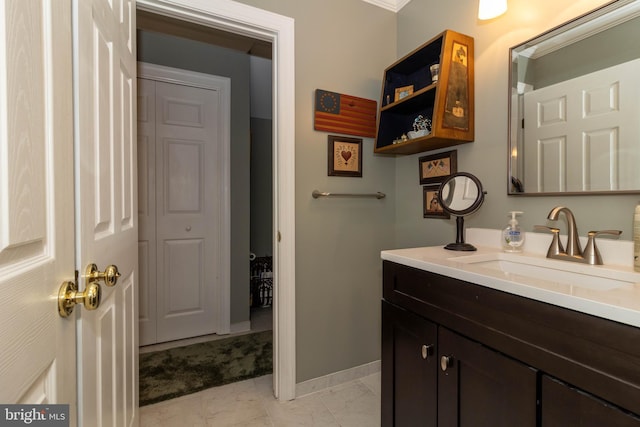 bathroom with vanity and ornamental molding