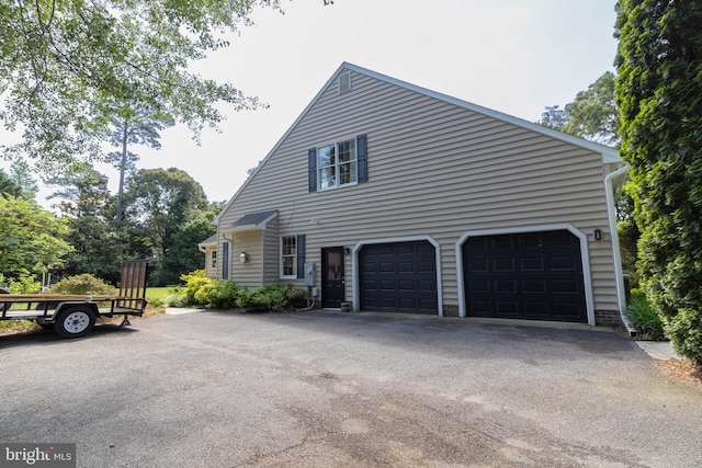 view of side of home with a garage