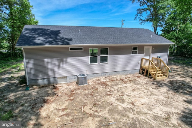 back of house featuring central AC unit