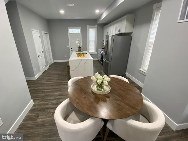 dining room featuring dark wood-type flooring