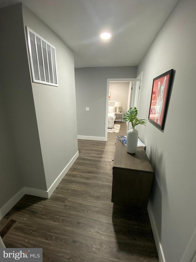 hall with dark hardwood / wood-style flooring