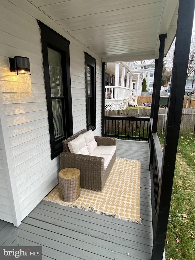 wooden terrace featuring a porch