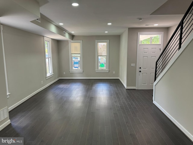 entrance foyer with dark hardwood / wood-style floors