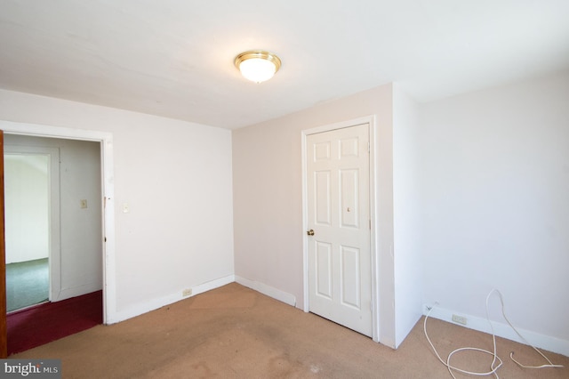 spare room with light colored carpet