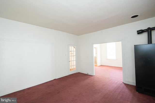 carpeted spare room with plenty of natural light