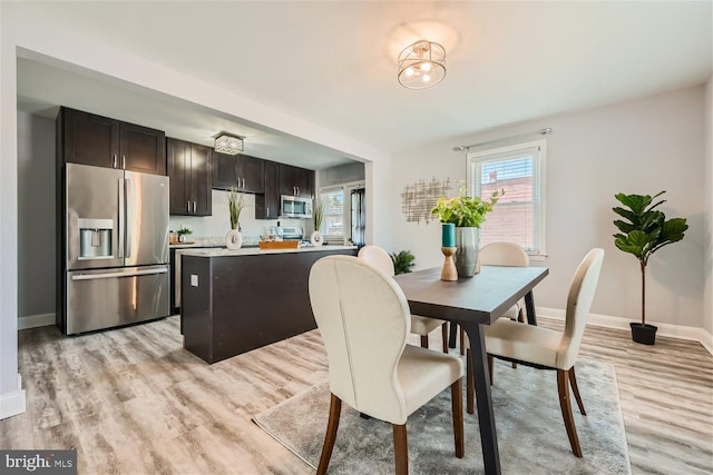 dining space featuring light hardwood / wood-style flooring