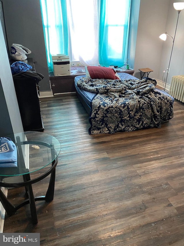 bedroom featuring dark hardwood / wood-style floors