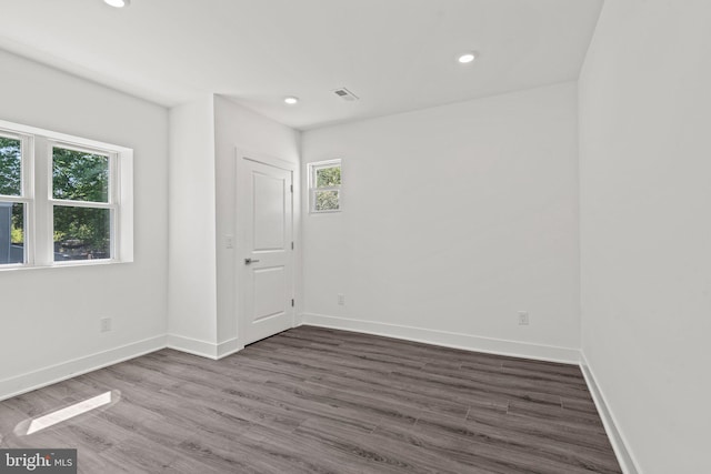 spare room with hardwood / wood-style floors