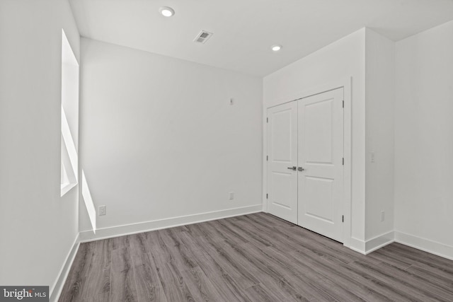 spare room with hardwood / wood-style floors