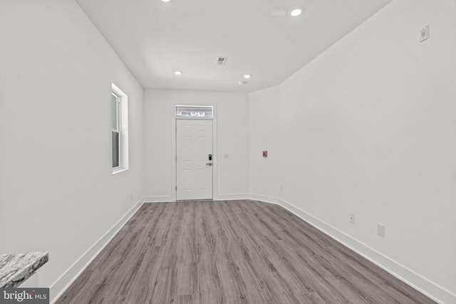 unfurnished room featuring hardwood / wood-style flooring