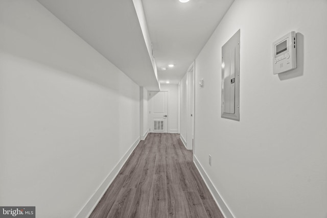 corridor featuring dark hardwood / wood-style flooring