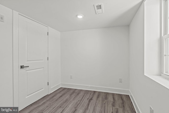 empty room featuring wood-type flooring