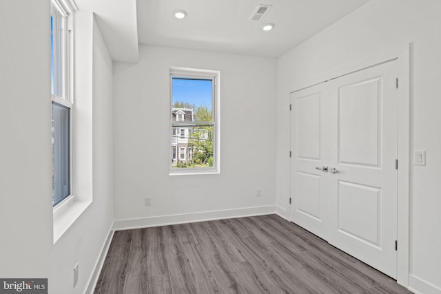 unfurnished bedroom featuring hardwood / wood-style flooring